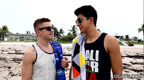 Gay men having fun by the shore then in the hotel room