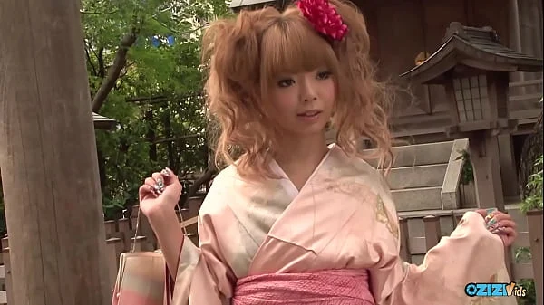 She engages in sexual activity with two men who manipulate her and ejaculate over her face