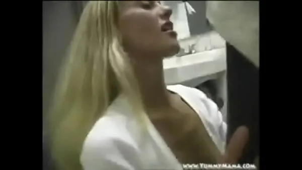 Slutty housewife gives a blow job and gets fucked in mens restroom taking a massive load on her face!