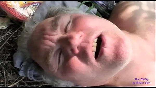 The slut sees two old men fucking in the open countryside and joins them