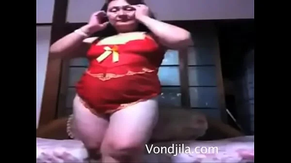 This sexy  old woman dance in front of camera