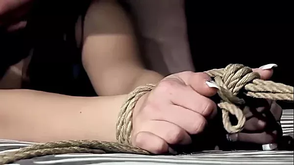 He spanks her ass with flog and hand until red marks on it. The sex slut is begging, but needs to tolerate the painful punishment and learn some manner.