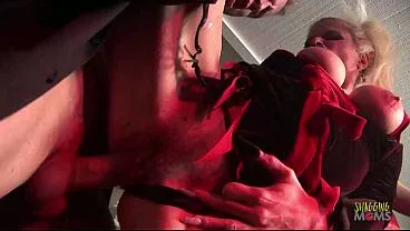 While the demonic blonde lays in her coffin the brunette milf inches closer only for her. As she does two men come in with their throbbing dicks out and ready to have rough group sex.